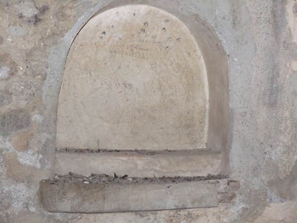 IX.9.10 Pompeii.  March 2009.  Lararium Niche on east wall. The shelf at the back of the niche contained a statuette of a female figure holding a patera umbilicata in her right hand. See Boyce G. K., 1937. Corpus of the Lararia of Pompeii. Rome: MAAR 14.  (459, Pl 41,1)
