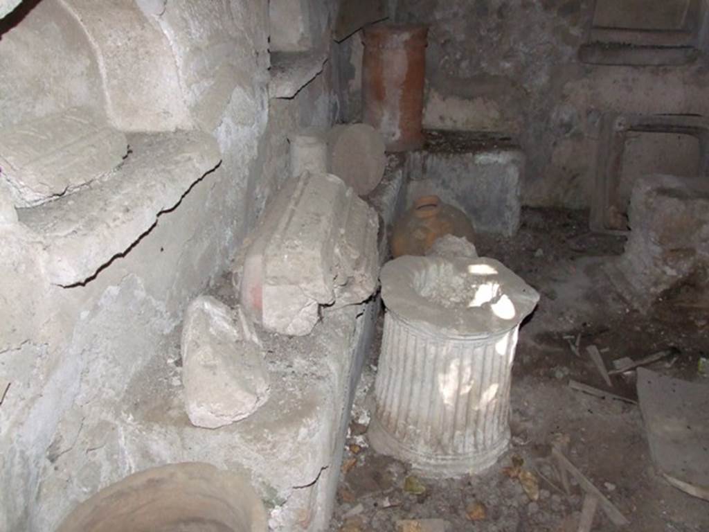 IX.9.10 Pompeii.  March 2009.   Masonry bench built along the north wall and part of the east wall.