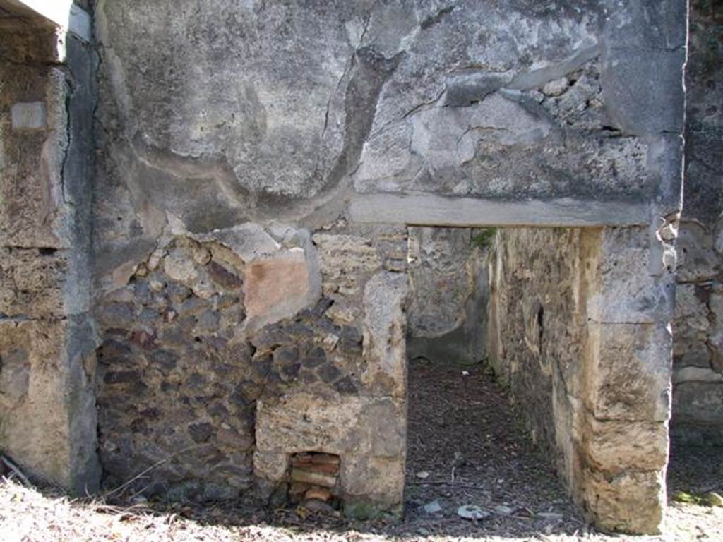 IX.9.11 Pompeii. March 2009. South side of atrium with doorway to room 2, cubiculum or sacellum.