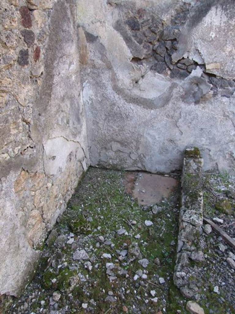 IX.9.12 Pompeii. March 2009. Room 15, north-west corner of kitchen.  According to NdS, another puteal above a cistern-mouth was found in this area next to the doorway from the light-yard. The water entered it from a type of small impluvium, which collected the water from the roof.
