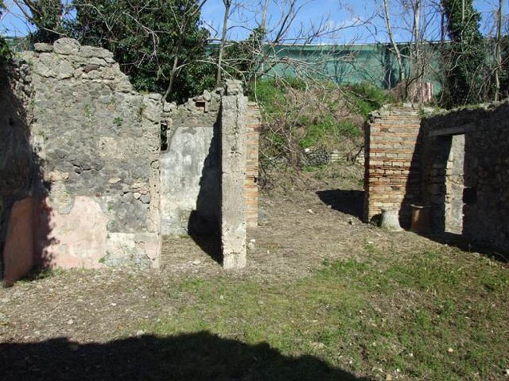 IX.9.12 Pompeii. March 2009. Looking east across room 11.  Doorways to room 14 , entrance doorway (centre), and room 12.
