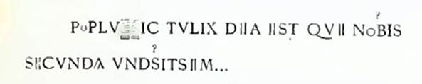 On the white background was a graffito, stretching from the idol to the head of the first worshipper.
PoPLV||IC TVLIX DIIA IIST QVII NoBIS
SIICVNDA VNDSITSIIM..

According to Epigraphik-Datenbank Clauss/Slaby (See www.manfredclauss.de) this read

Poplu[3]ictulix dea est que nobis
Secunda Vndsitsem       [CIL IV, 5257]
