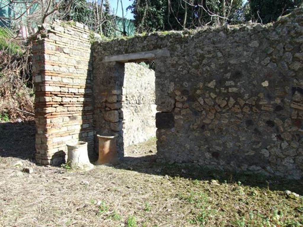 IX.9.12 Pompeii.  March 2009.  Looking south east across entrance yard to Doorway to Room 12, Stables.