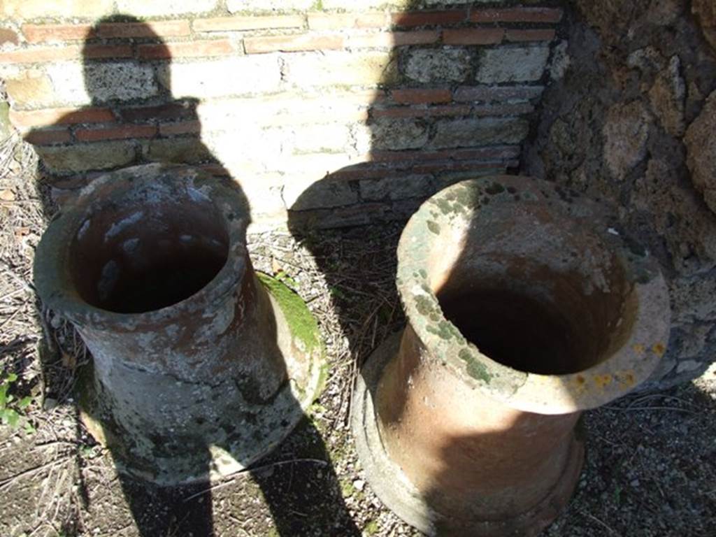 IX.9.12 Pompeii.  March 2009.  Two terracotta puteals.