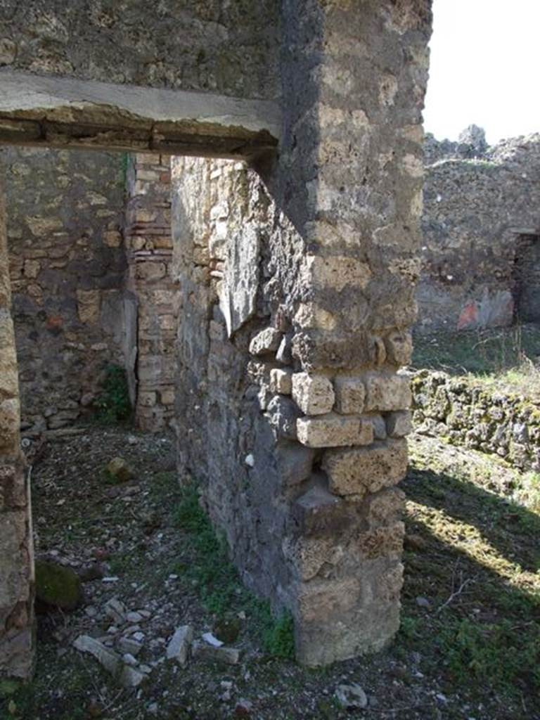 IX.9.13 Pompeii.  March 2009.  Room 4, Cubiculum.  Looking west through small doorway linking to Room 5, Cubiculum.