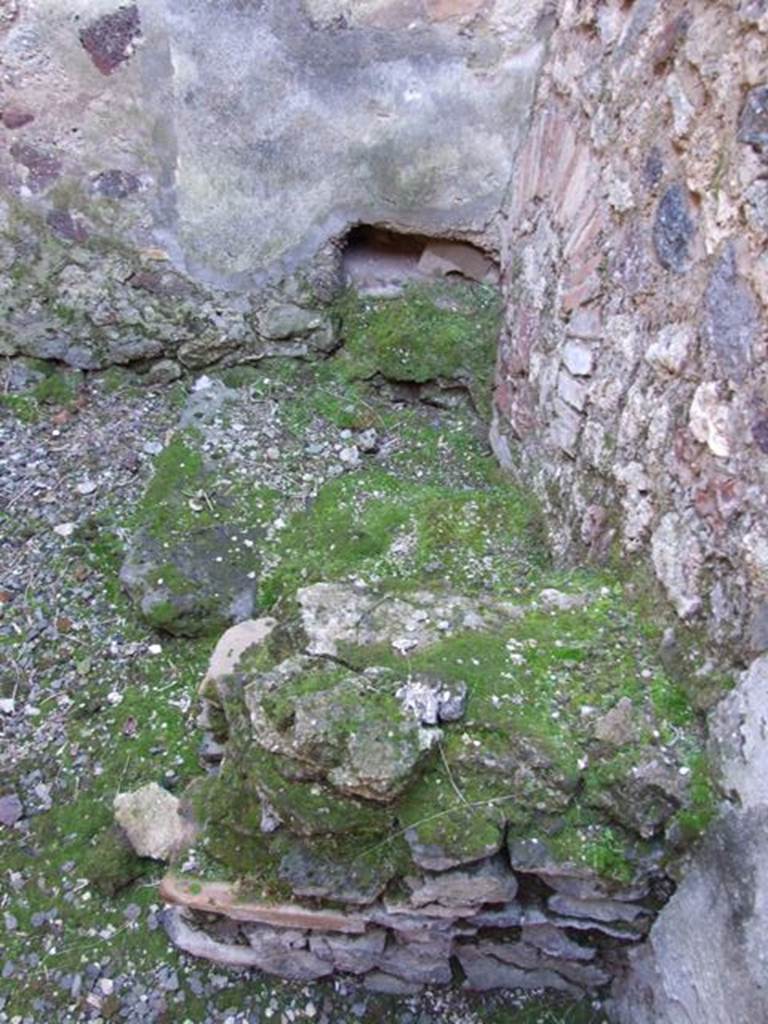 IX.9.a Pompeii.  March 2009. North-west corner of kitchen, looking west across latrine.