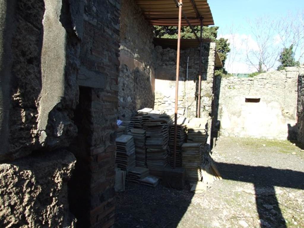 IX.9.d Pompeii. March 2009. Looking east along north side of atrium b.
According to NdS, on the west side of the atrium and precisely on the wall of the small room d, two gladiators in combat (0.36 high) were painted on a layer of plaster: 
Another pair were painted slightly higher above, but now few traces remained.
Below them, in charcoal, many vertical lines were drawn and the number X repeated many times.
Another gladiator (0.76 high), completely armed and in the attitude of fighting, was painted on the black background of the north wall.
See Notizie degli Scavi, 1889, p.130
