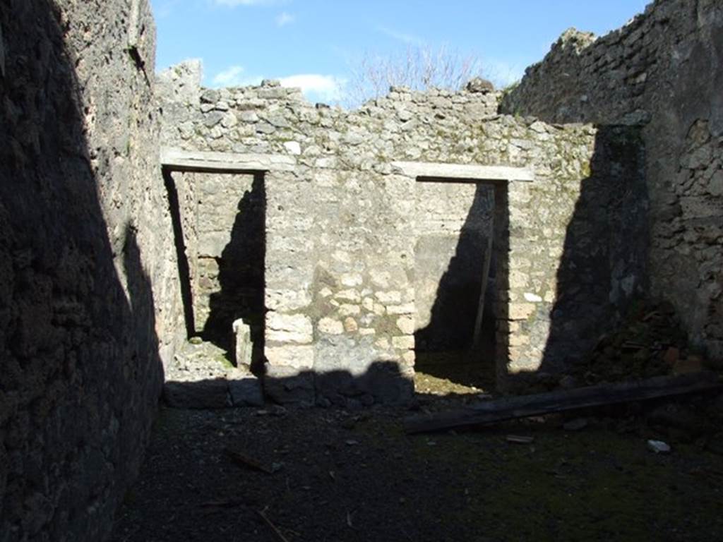 IX.9.f Pompeii.  March 2009.  Doorways on east side of atrium, to Staircase to upper floor, and Tablinum (or Triclinium?)