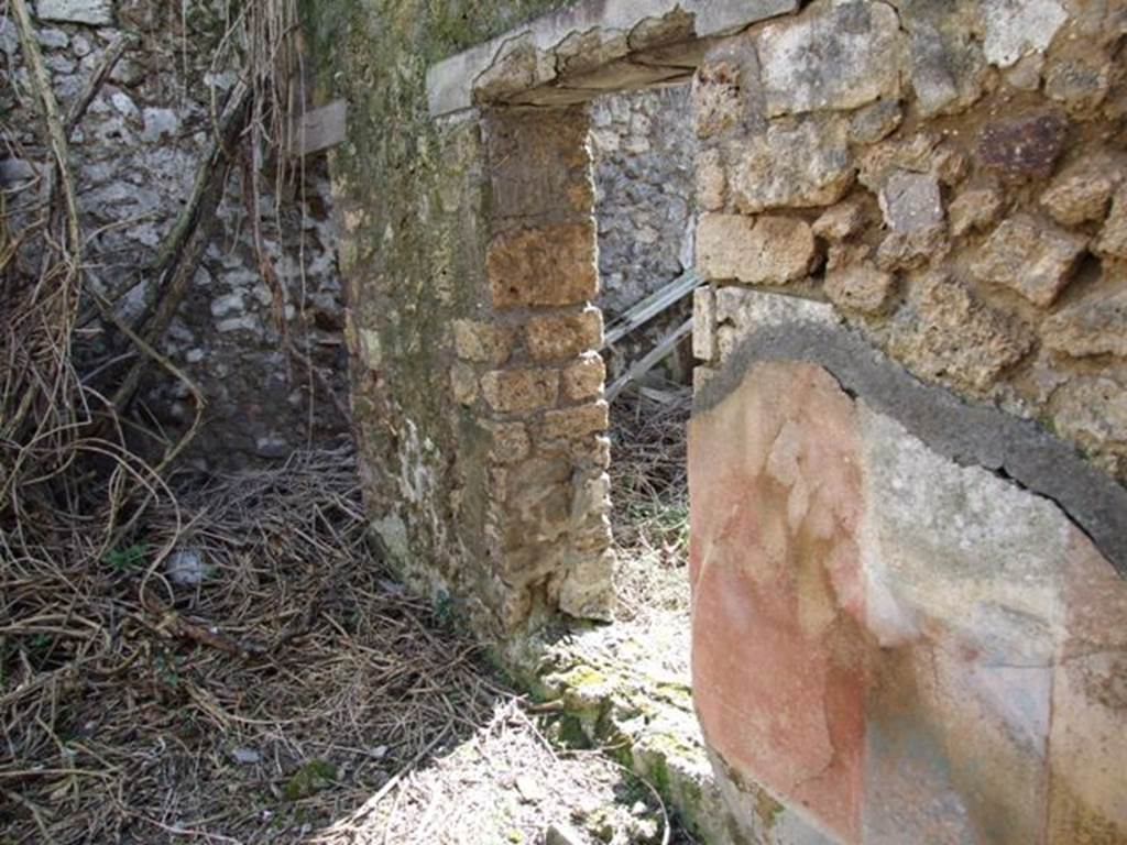 IX.9.g Pompeii. March 2009. West wall of triclinium with a window onto the light-yard, as well as a doorway.