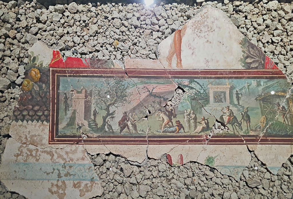 IX.10.1 Pompeii. March 2024. 
Detail of fragment of ceiling with painting showing a wayfarer in a Nilotic scene, on display in an exhibition entitled –
“L’altra Pompei, vite comuni all’ombra del Vesuvio”. Photo courtesy of Giuseppe Ciaramella.

