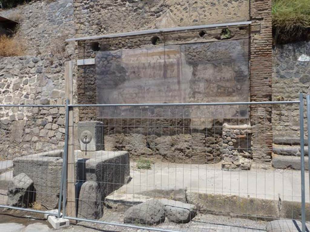 IX.11.1 Pompeii. June 2012. Photo courtesy of Michael Binns. North side of Via dellAbbondanza, on the extreme left is the unexcavated roadway between IX.7 and IX.11.
On the extreme right is the entrance doorway to IX.11.1.
