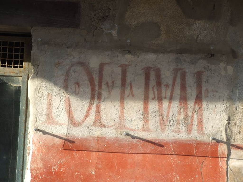 IX.11.2 Pompeii. December 2006. Lollium graffiti on east side of entrance.  
According to Epigraphik-Datenbank Clauss/Slaby (See www.manfredclauss.de), this read as - Lollium  d(ignum)  v(iis)  a(edibus)  s(sacris)  p(ublicis)  o(ro)  v(os)  f(aciatis)      [CIL IV 7868]
  