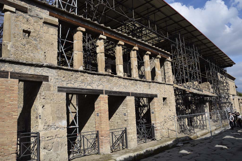 IX.12.2/3/4/5, Pompeii. February 2017. Looking east along front façade with entrance doorways. Photo courtesy of Johannes Eber.