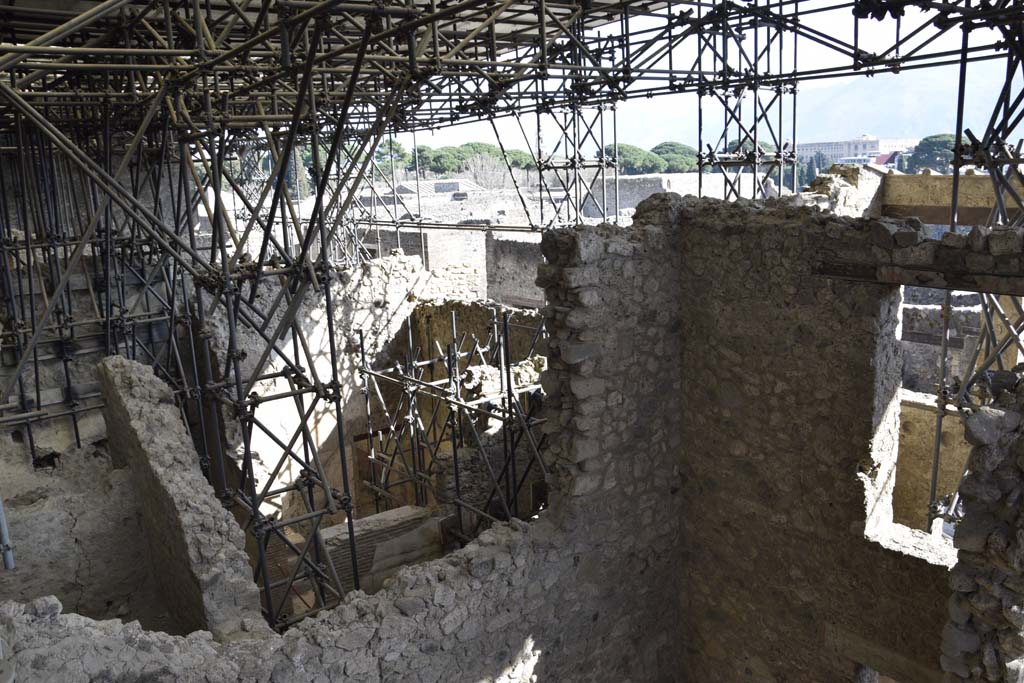 IX.12.5, IX.12.4, and IX.12.3, Pompeii. February 2017. 
Looking south-east towards rear view of upper terrace, and partly excavated rooms below. Photo courtesy of Johannes Eber.
