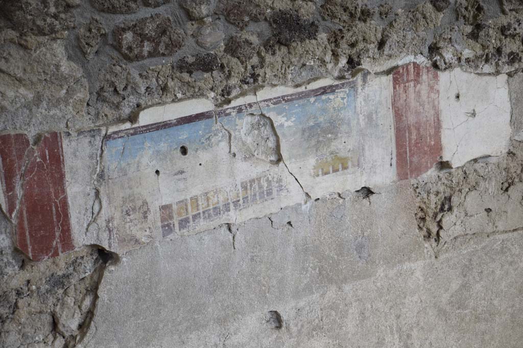 IX.12.5/4 Pompeii. February 2017. 
Detail of painted east wall in room being excavated, on west side of bakery at IX.12.6. Photo courtesy of Johannes Eber.

