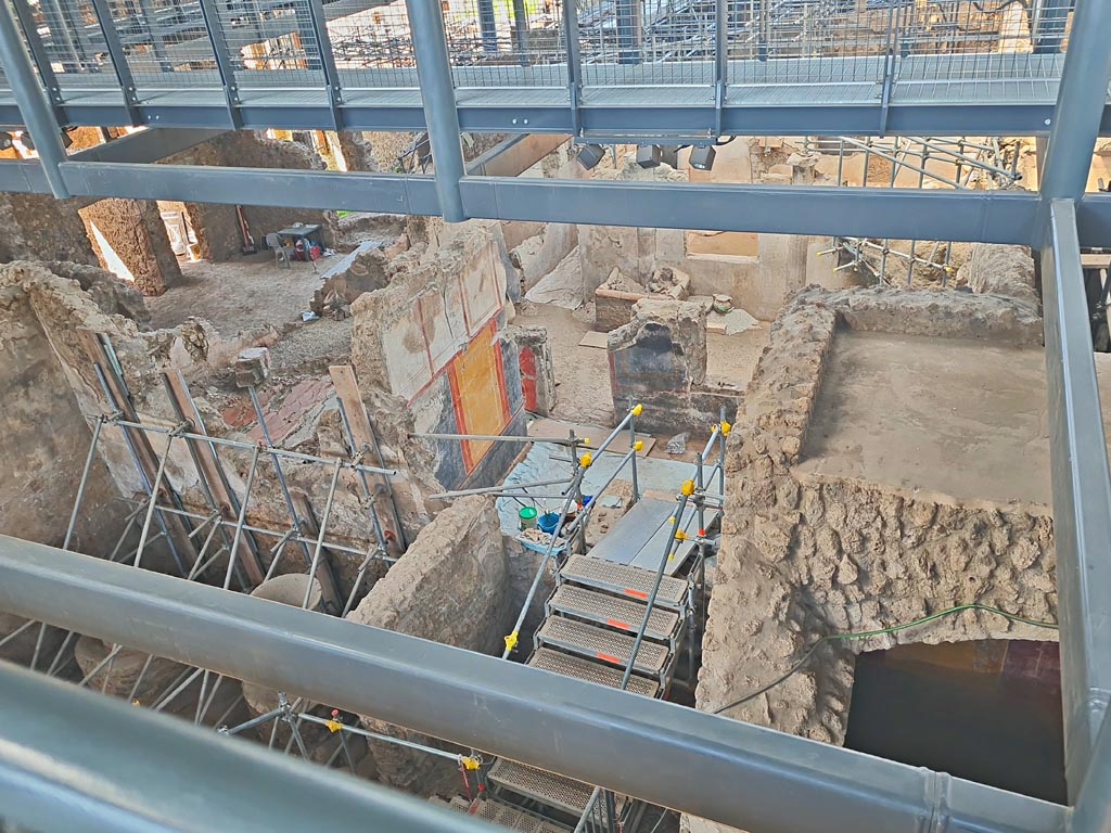 IX.12.6/4 Pompeii. June 2024. 
Looking west from above room 5, bakery. The stairs descend into room 12. Photo courtesy of Giuseppe Ciaramella.
