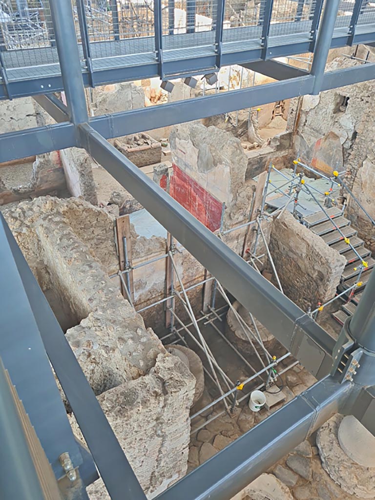 IX.12.6/4 Pompeii. June 2024. 
Looking west from above room 5, bakery. The stairs descend into room 12. Photo courtesy of Giuseppe Ciaramella.

