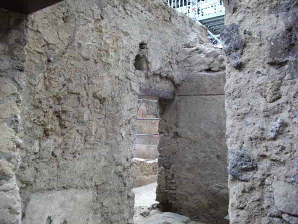 IX.12.8 Pompeii. May 2010. Entrance doorway and south wall of stable.  Looking through doorway into room 6 of IX.12.6.