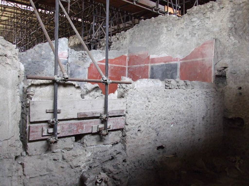 IX.12.8 Pompeii. December 2006. West wall of stable, with view across stable to triclinium of IX.12.6.
