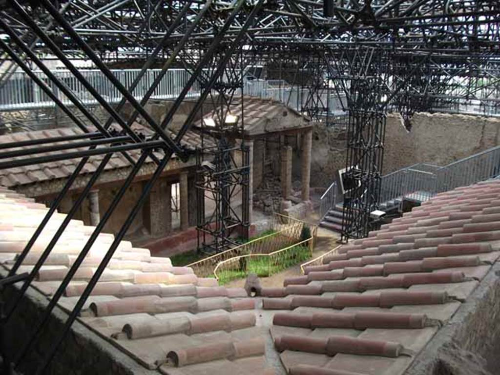 IX.12.9 Pompeii. May 2010. Looking south east across roof of portico of garden area 8.