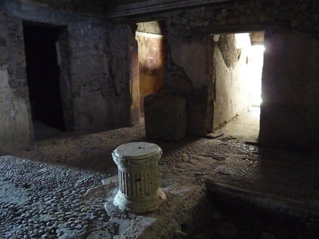 IX.13.1-3 Pompeii. May 2012. Room 2, atrium. Puteal at south end of impluvium. Looking south-west across atrium. Photo courtesy of Buzz Ferebee.

