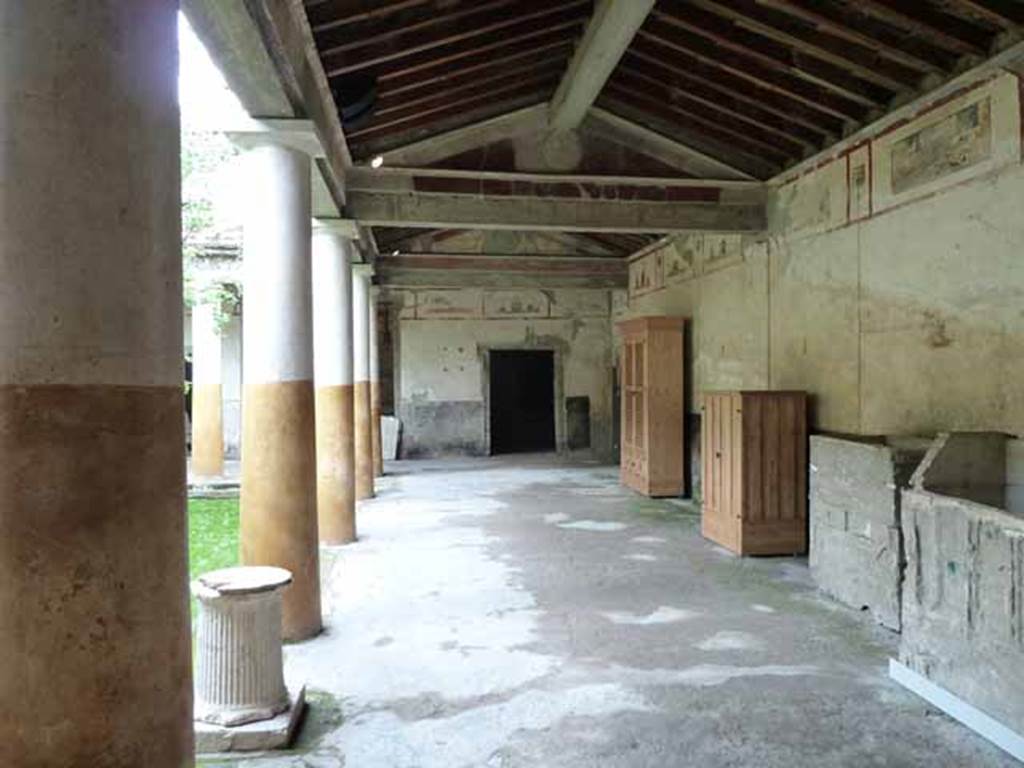 IX.13.1-3 Pompeii. May 2010. Room 9, looking north along east portico.