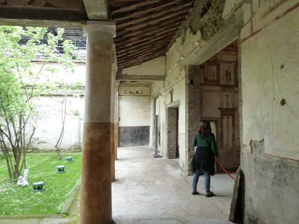 IX.13.1-3 Pompeii. May 2010.  Room 9, north portico, looking west from near room 11.