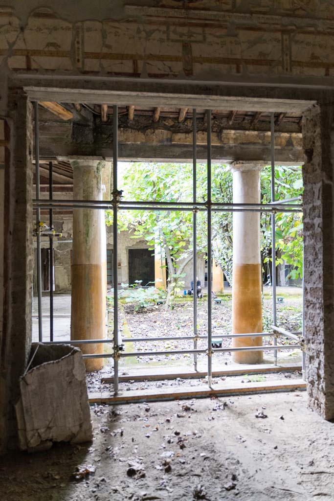 IX.13.1-3 Pompeii. October 2021. 
Room 11, looking south to peristyle. Photo courtesy of Johannes Eber.

