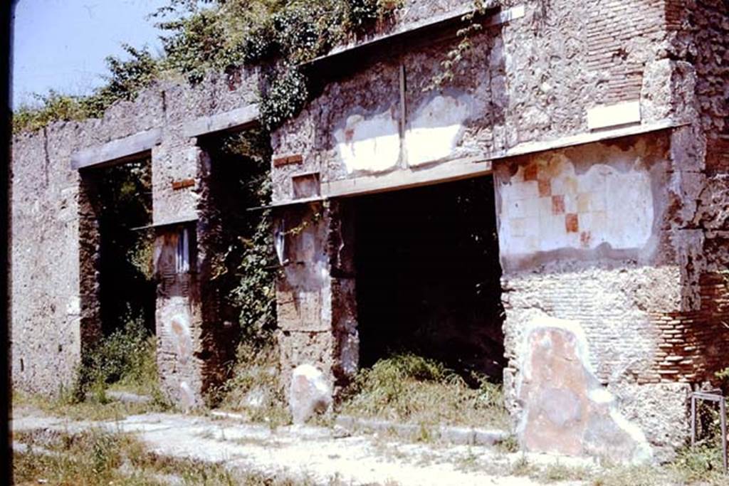 IX.13.4 Pompeii, on left. 1961. 
Looking towards doorways to IX.13.4, IX.13.5 and IX.13.6 on north side of Via dell’Abbondanza. Photo by Stanley A. Jashemski.
Source: The Wilhelmina and Stanley A. Jashemski archive in the University of Maryland Library, Special Collections (See collection page) and made available under the Creative Commons Attribution-Non-Commercial License v.4. See Licence and use details.
J61f0707

