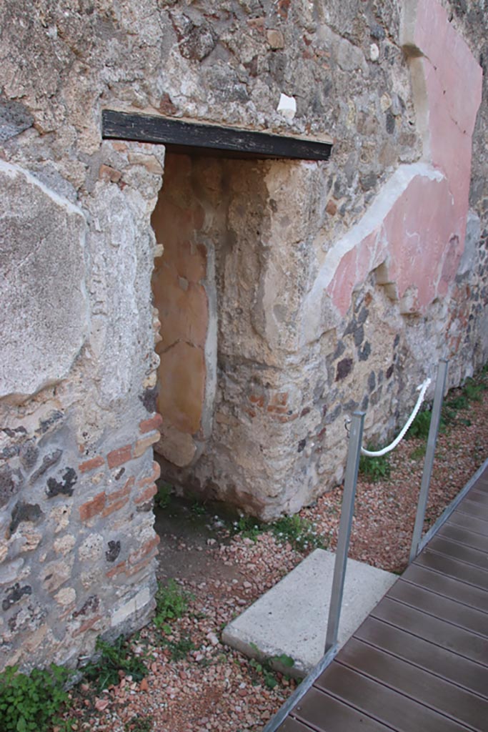 HGW24 Pompeii. Villa of Diomedes. October 2023. 
Doorway to baths complex in east wall of peristyle. Photo courtesy of Klaus Heese.
