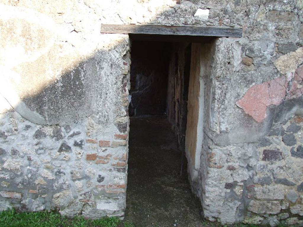 HGW24 Pompeii. Villa of Diomedes. October 2023. 
Doorway to baths complex in east wall of peristyle. Photo courtesy of Klaus Heese.
