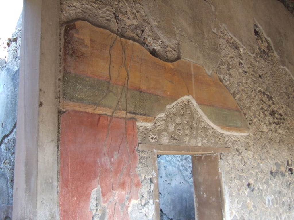 Villa of Mysteries, Pompeii. May 2006. Painted wall above doorway to room 33.