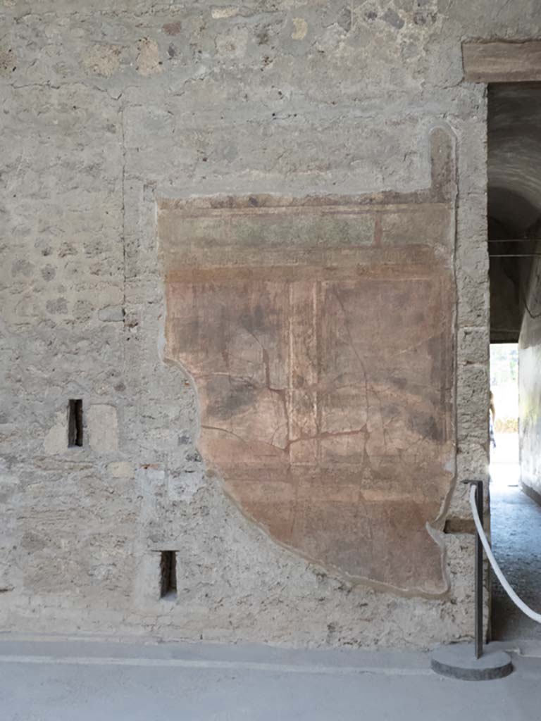 Villa of Mysteries, Pompeii. September 2017. 
Room 64, south wall with painted decoration on east side of doorway to corridor F1, on right. 
Foto Annette Haug, ERC Grant 681269 DÉCOR.
