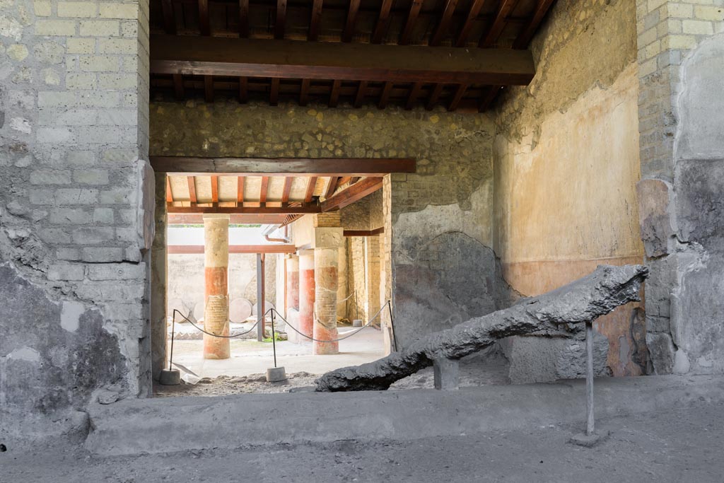 Villa Regina, Boscoreale. October 2021. 
Room IX, looking east towards plaster-cast of wine press, from room IXbis, torcularium. Photo courtesy of Johannes Eber.

