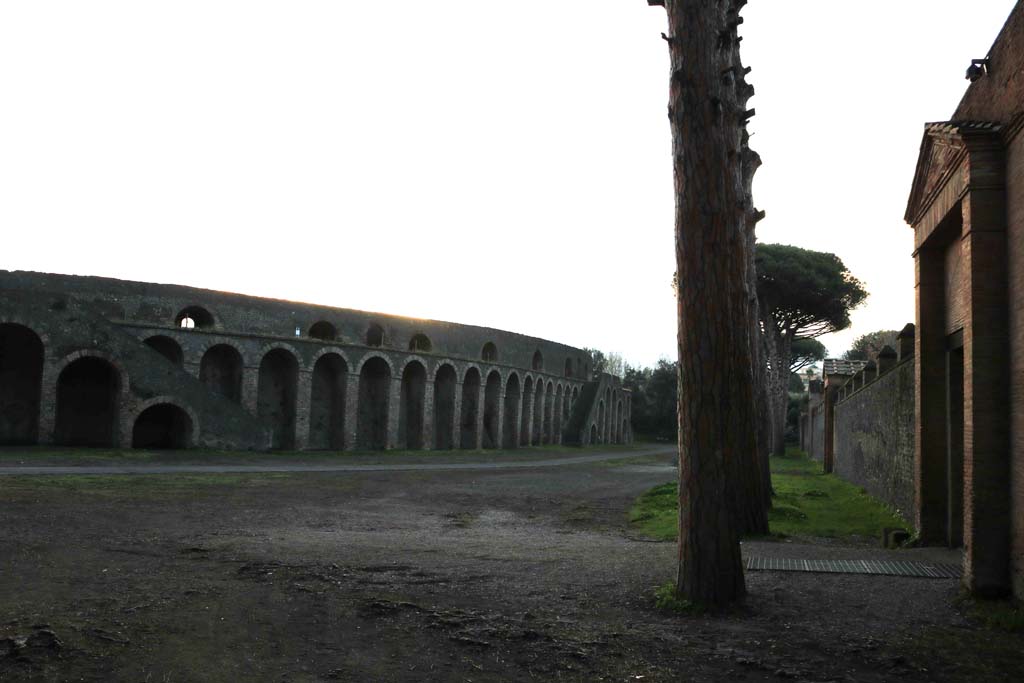 Piazzale Anfiteatro, December 2018. 
Looking south from II.7.5, Amphitheatre on left, Grand Palaestra, on right. Photo courtesy of Aude Durand.
