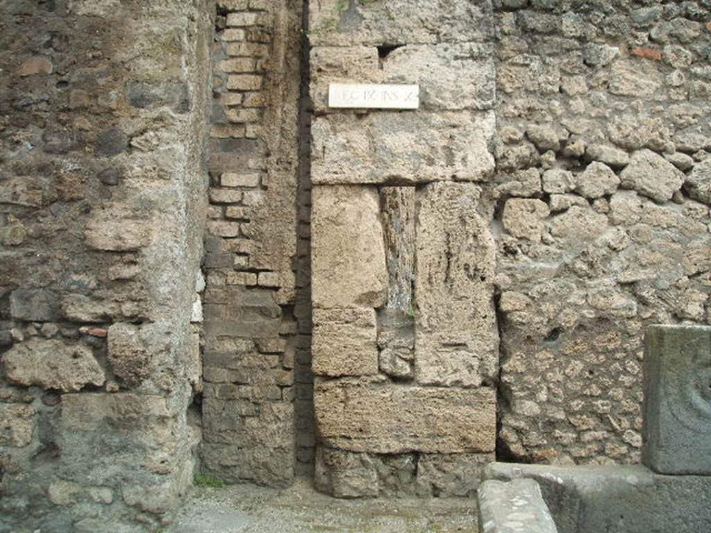 Modern bridge support (on left) is blocking the road between IX.14 and IX.10. May 2006.
Brickwork in centre is the remains of a water tower. Large stone blocks and infill to right are the corner of IX.10.2. 
