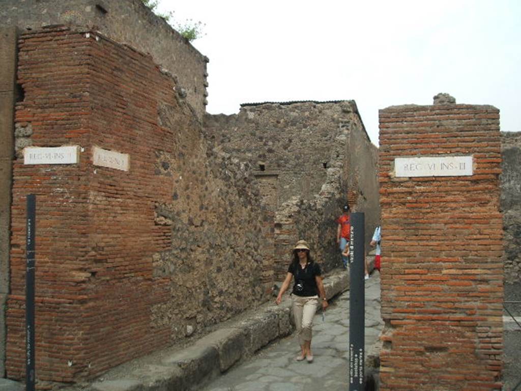 Via Consolare. Looking east  into Vicolo di Mercurio, between VI.2 and VI.3. May 2005.