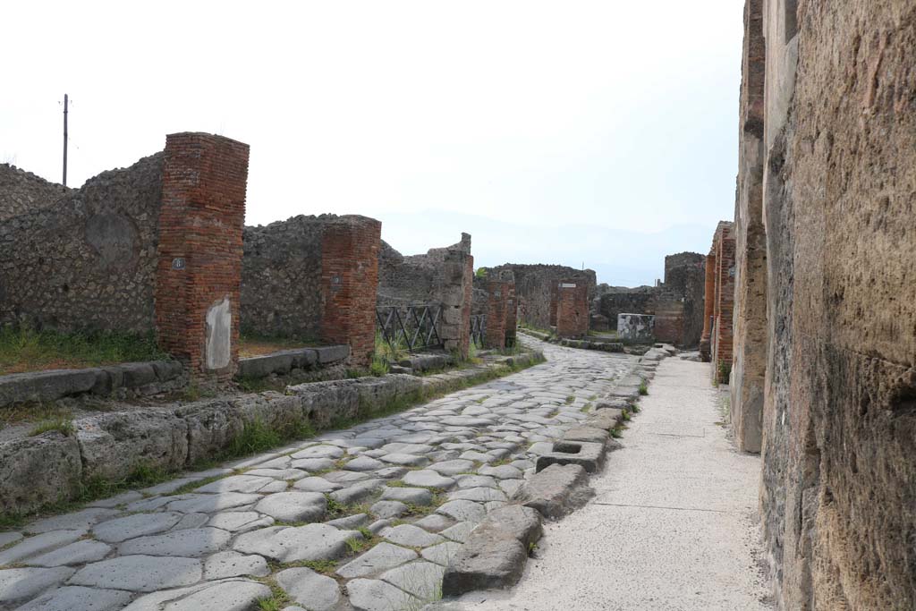 Via Consolare, Pompeii, east side. December 2018. 
Looking south along east side from VI.3.8, on left, towards VI.3.13. Photo courtesy of Aude Durand. 
