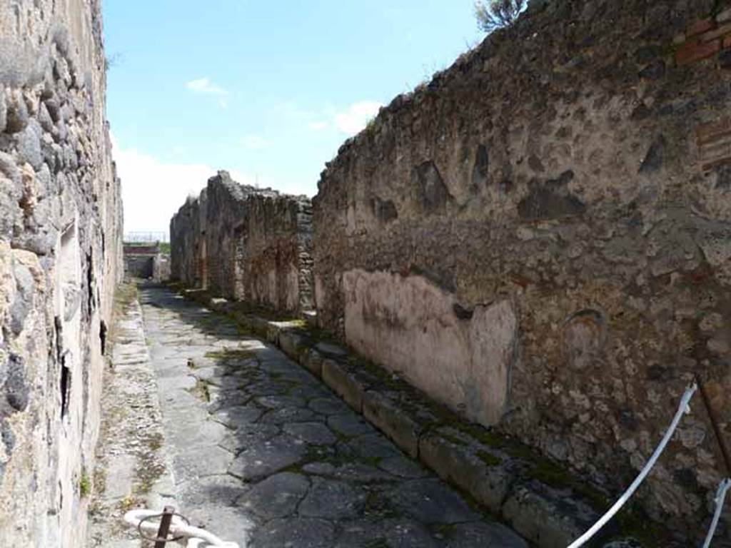 Via Stabiana, east side, May 2010. Looking east along Vicolo di Balbo, between IX.2 and IX.1