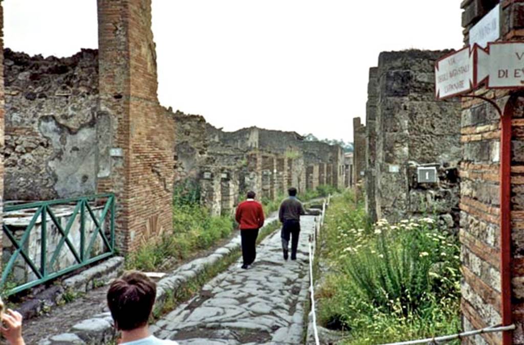 Via degli Augustali between VII.2 and VII.12. 1989. Looking east from crossroads, outside of VII.12.1. Photo courtesy of Anne Fettis. 
