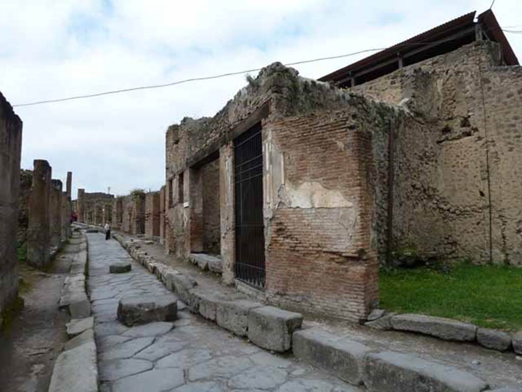 Via degli Augustali, north side, May 2010. Looking west from near VII.2.46