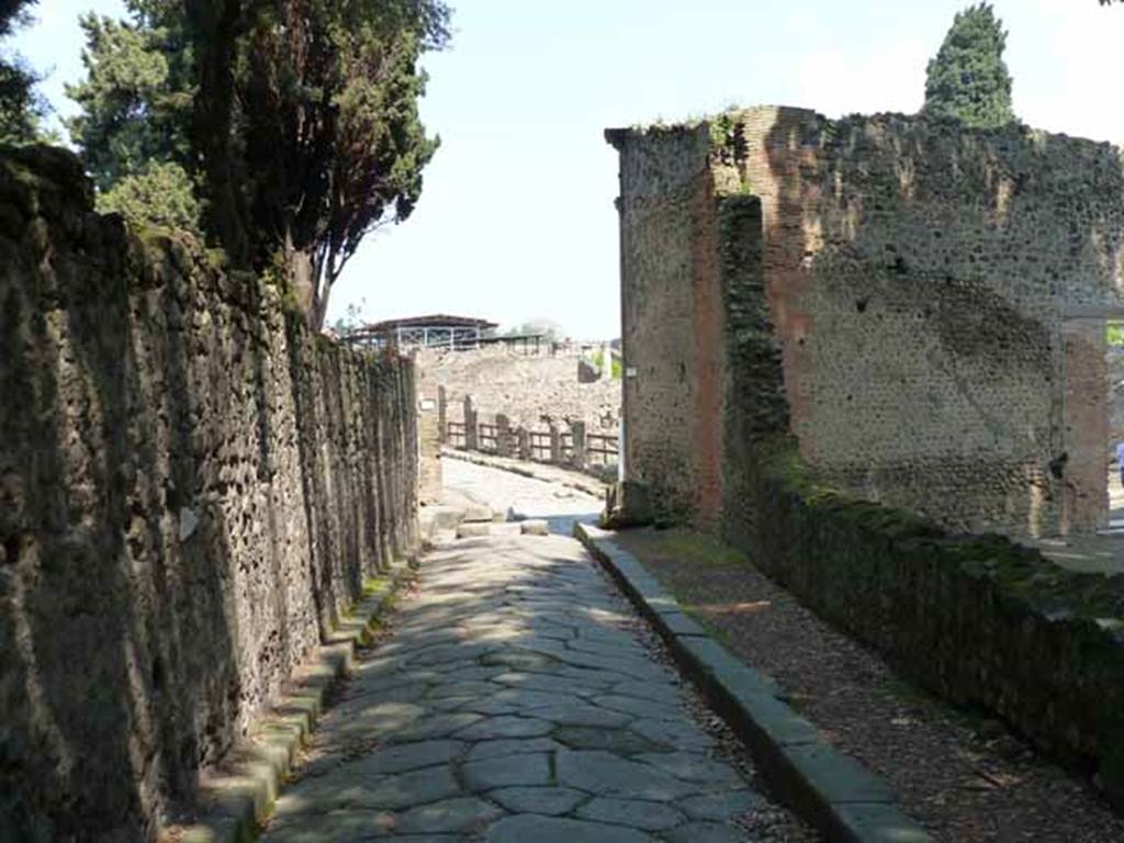 Via dei Teatri, May 2010. Looking north between VIII.6 and VIII.7.