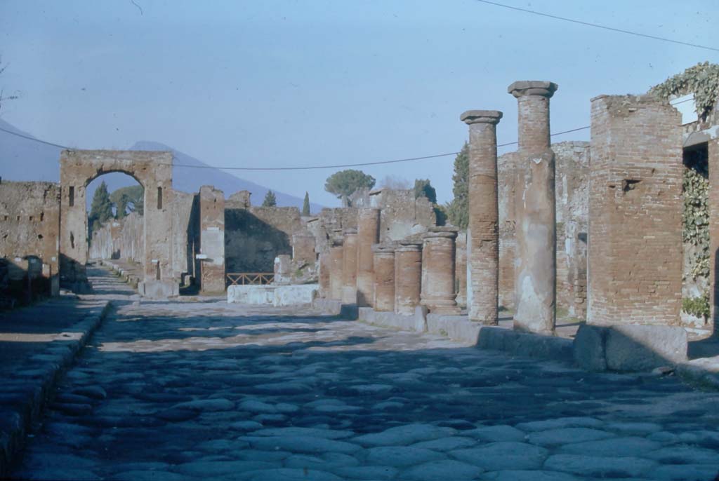 Via del Foro, Pompeii. 4th December 1971. Looking north to Arch at junction with Via Mercurio. 
Photo courtesy of Rick Bauer, from Dr. George Fay’s slides collection.
