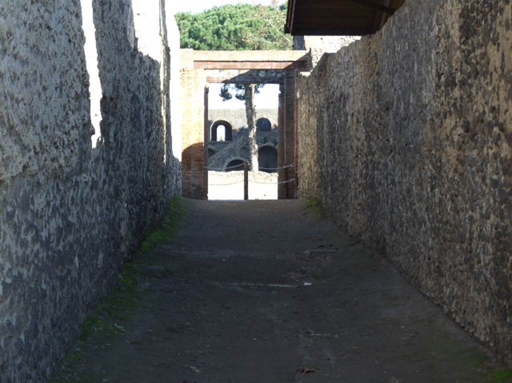 Via della Palestra between II.9 and II.8. Looking east towards junction with unnamed vicolo to left and right on the west side of the Palestra. December 2006.