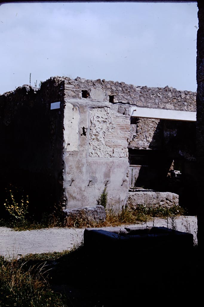 Via di Castricio, north side, Pompeii. 1964. Looking north towards I.11.11, from fountain at I.16.4   
Below the site of the sign of the Phoenix, CIL IV 9851 can still be read. Photo by Stanley A. Jashemski.
Source: The Wilhelmina and Stanley A. Jashemski archive in the University of Maryland Library, Special Collections (See collection page) and made available under the Creative Commons Attribution-Non-Commercial License v.4. See Licence and use details.
J64f1492
