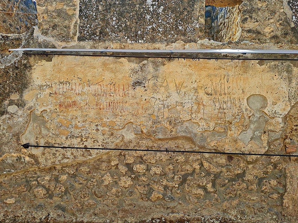 Via di Castricio, Pompeii. September 2024. Graffiti on wall between I.14.7 and I.14.8. Photo courtesy of Giuseppe Ciaramella.