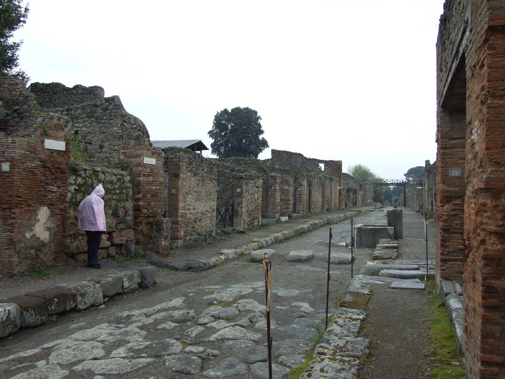 Via di Nola, north side, May 2010. Looking east to junction with unnamed vicolo and V.3, from near IX.5.12.