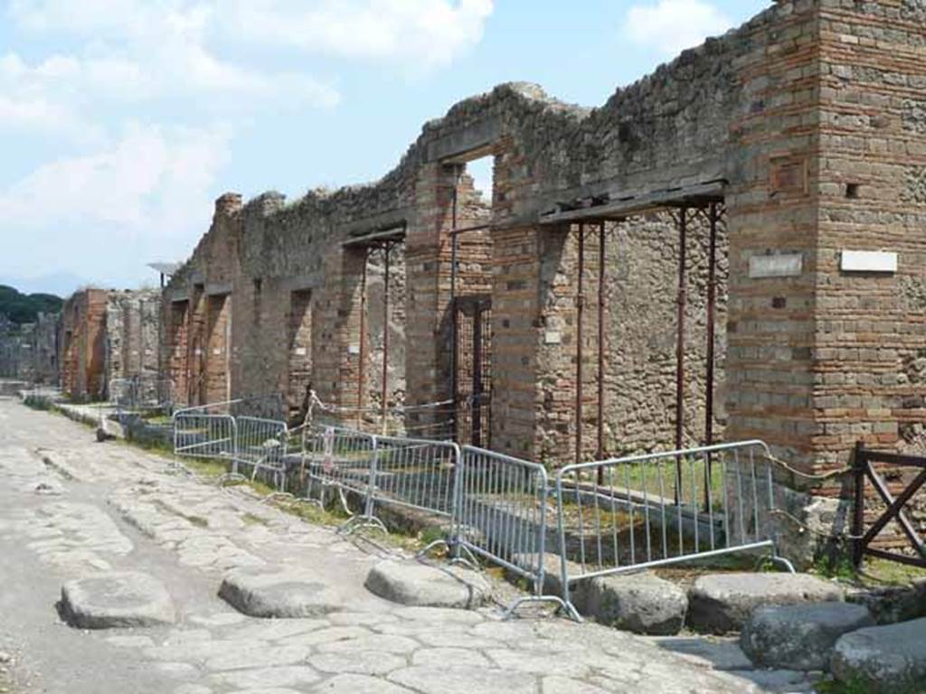 Via di Nola, south side, May 2010. Looking east along IX.5, from junction with Vicolo di Tesmo.