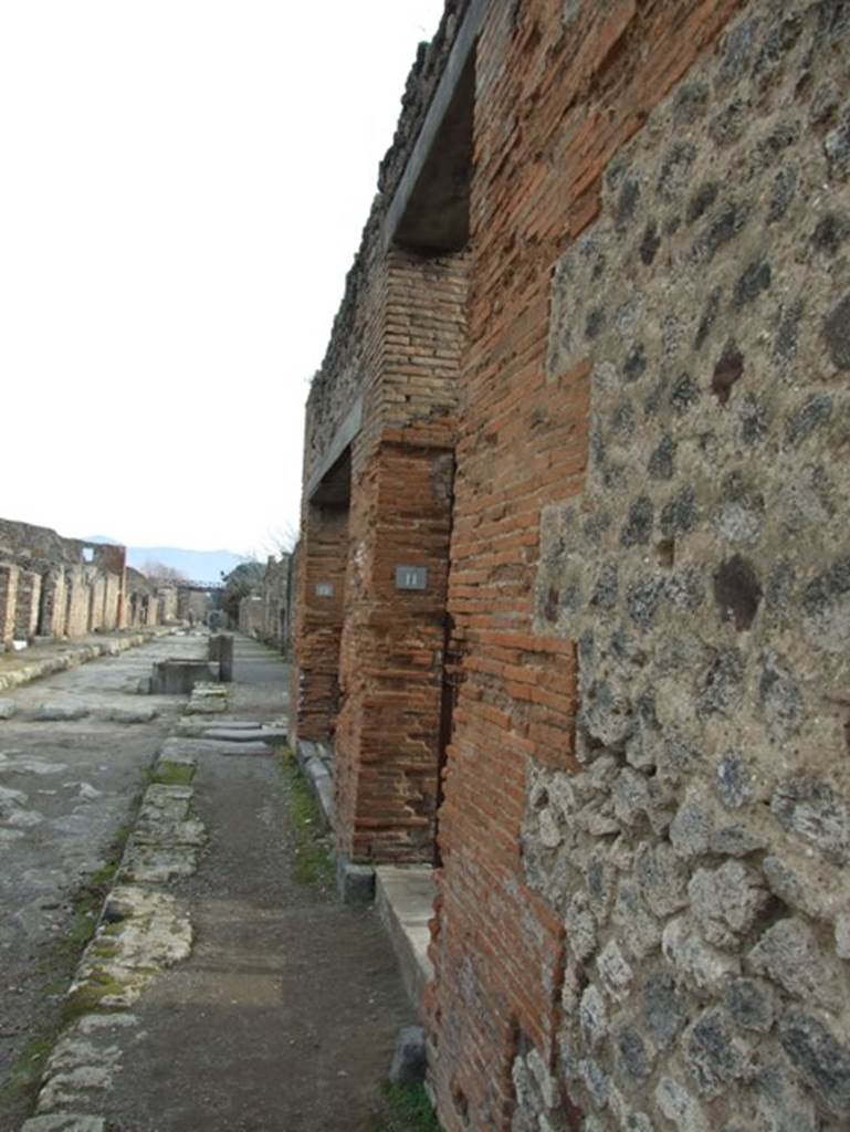 Via di Nola at IX.5.11. South side. Looking east to junction with Vicolo del Centenario. December 2007.