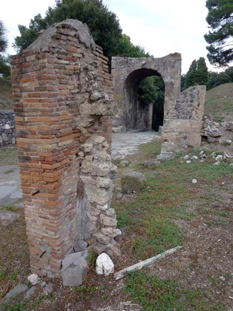 Via di Nola, September 2011. Looking east towards Nola Gate, from dividing pilaster between III.11.5-6. Photo courtesy of Michael Binns.
